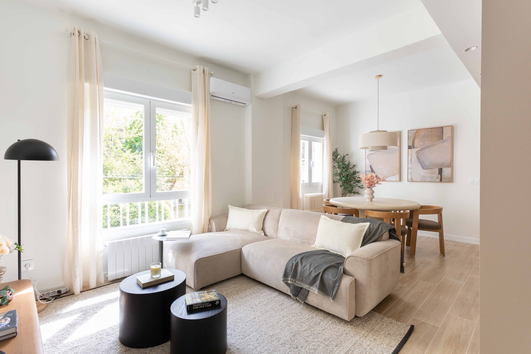 Furnished Akora living room with a sectional sofa in central Madrid